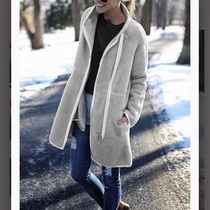 High-neck zip button long sleeve top.